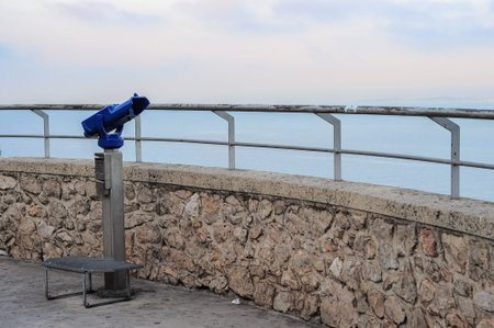 Binoculars in point of view in Nice at sunrise