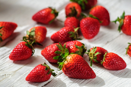 Strawberry on white shabby wooden backgroundの写真素材
