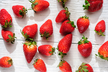 Strawberry on white shabby wooden backgroundの写真素材