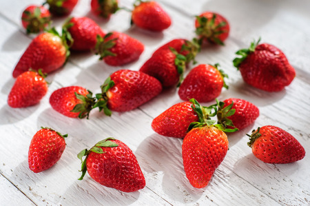 Strawberry on white shabby wooden backgroundの写真素材