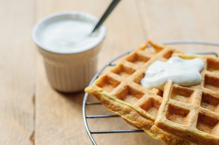 Zuccini homemade hash brown waffles with sour creamの写真素材