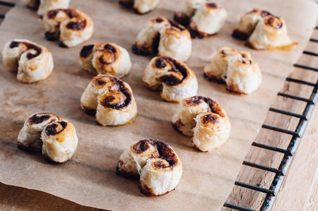 French puff pastry heart cookies on a baking paperの写真素材