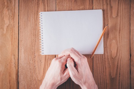 Man hands writing notes in notebook on springの写真素材