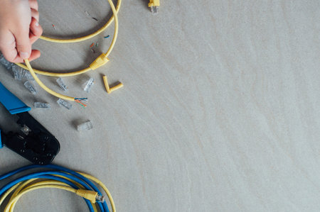 Technician building networking data cable with special tools