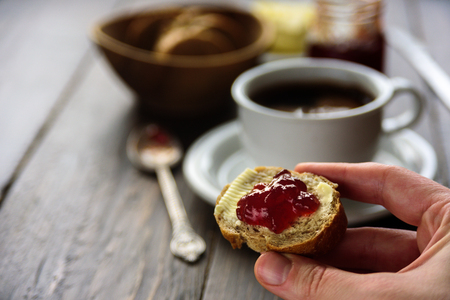 Breakfast with coffee, bread, butter and jam. Close upの写真素材