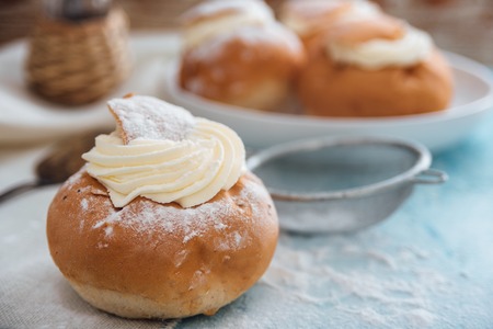 Semla swedish cream bun on light blue backgroundの写真素材