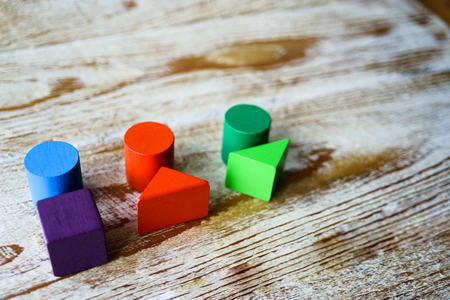 Female body shapes - three types, flat lay. Abstract female body types made from colorful wooden blocksの写真素材