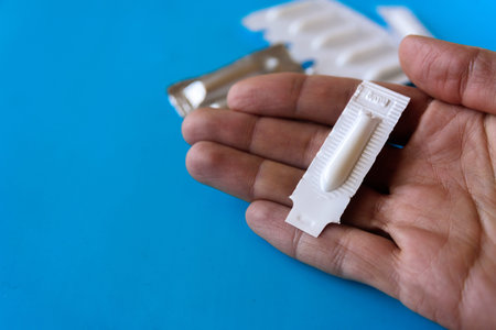 Suppository pack on blue background. Close up