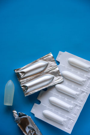 Suppository pack on blue background. Close up