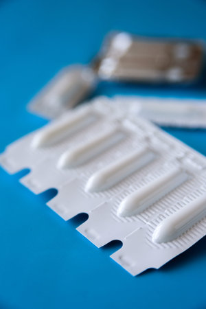 Suppository pack on blue background. Close up
