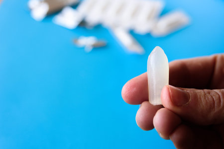 Suppository pack on blue background. Close up