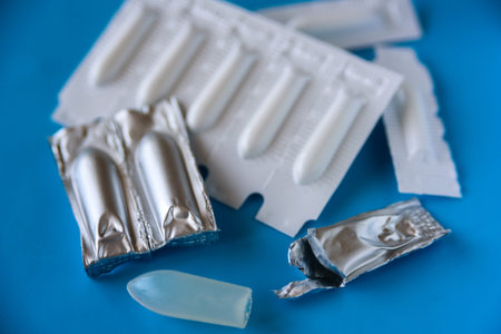 Suppository pack on blue background. Close up