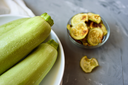 Healthy snack - baked zucchini chips. Vegan food, hamemadeの写真素材