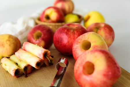 Fresh apples without core. Removed with corer tool. Ingredient for jam or pie. Harvestの写真素材