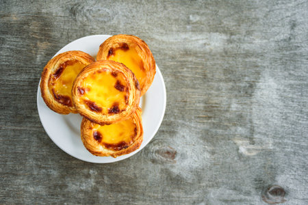 Portugal Egg tarts Pastel de Nata serving on plate. Top view