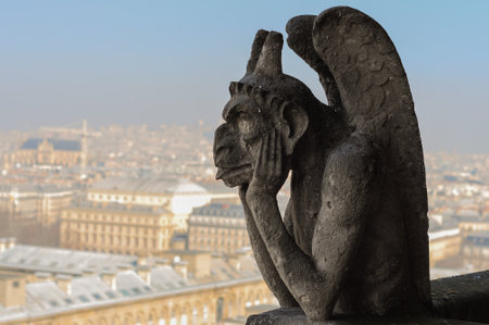 Paris, France - March 17, 2015: Strix or stryge sculpture on Notre Dame de Paris facadeのeditorial素材