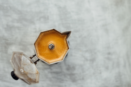 Moka pot with fresh brewed coffee on grey backgroundの写真素材