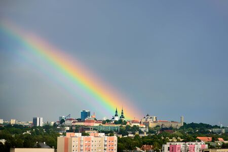 Big rainbow over Tallinn, Estonia. Moment just after rain. Panoramic view to Old Townの写真素材