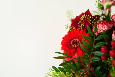 Beautiful red flower bouquet with roses on grey backgroundの写真素材