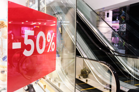 Red Sale sign in shopping mall. Seasonal sale. Nobody