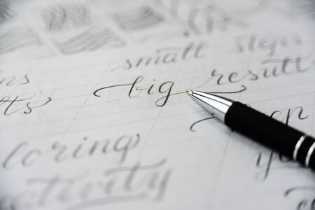 Handwriting calligraphy sheets. Words with design elements, pen. Handwritig day conceptの写真素材
