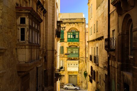 Colorful traditional Maltese balconies in Valletta. Street at sunny dayの写真素材