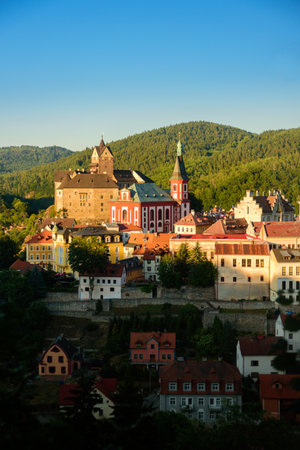 Loket, Czech - July 2 2019: Castle Loket at sunset, Czech. Beautiful light and hills around cityのeditorial素材