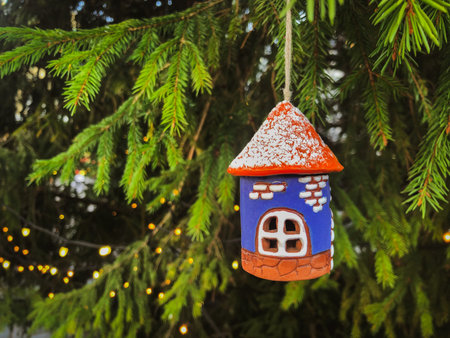 Ceramic Christmas decoration Old Tower on tree with lights. Tallinn Christmas Market