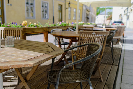 Empty tables in street summer terrace cafe, Tallinn, Estonia