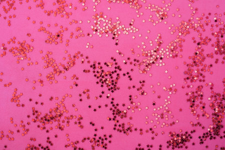 Pink background with many small stars glitter