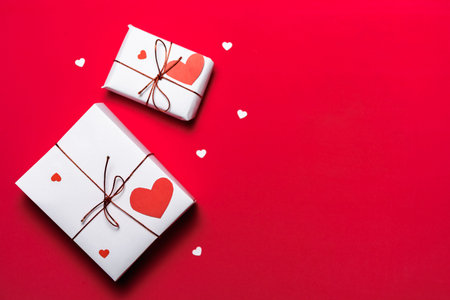 Valentines day gifts on red with red hearts