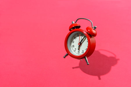 Jumping red retro alarm clock. Alert, reminder or deadline