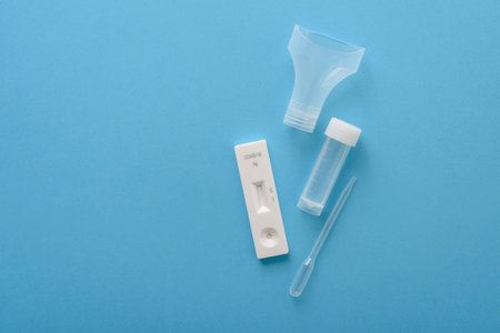 Covid19 antigen test kit with cassette, pipette and plastic bottle for saliva
