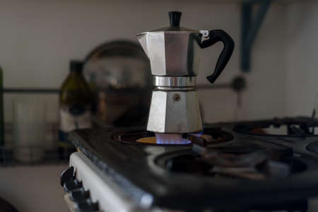 Moka coffeemaker on gas stove in old soviet kitchenの写真素材