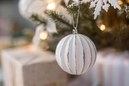 White Christmas decoration vintage ball on tree with lightsの写真素材