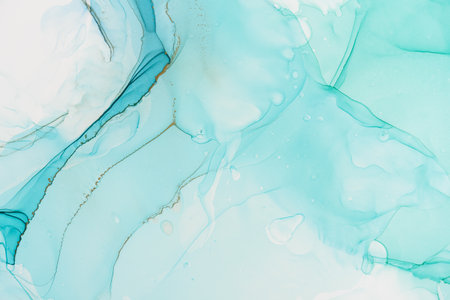Abstract alcohol ink fluid art background in blue and greenの写真素材