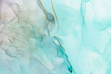 Abstract alcohol ink fluid art background in blue and greenの写真素材
