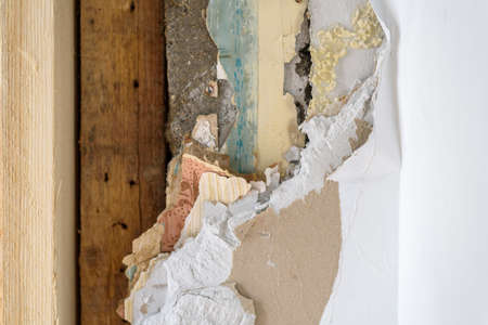 Construction Material layers on old wall during renovationの写真素材