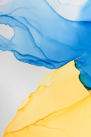 Abstract alcohol ink fluid art background. Blue and yellow colorの写真素材