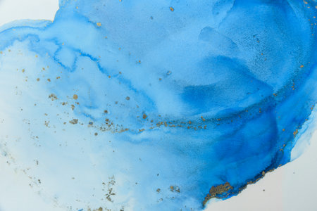 Abstract alcohol ink fluid art background. Blue color with goldの写真素材