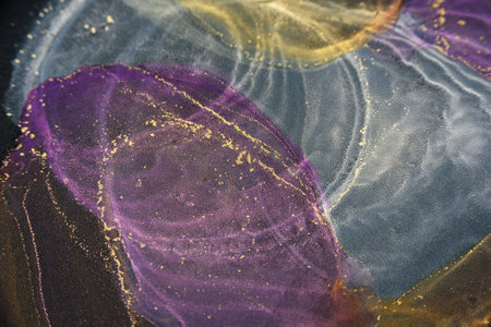Abstract alcohol ink fluid art background on black. White, purple and copper color clouds with goldの写真素材