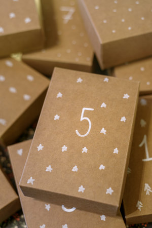 Paper handmade boxes to Christmas Advent Calendar with day numbers and drawn patternの写真素材