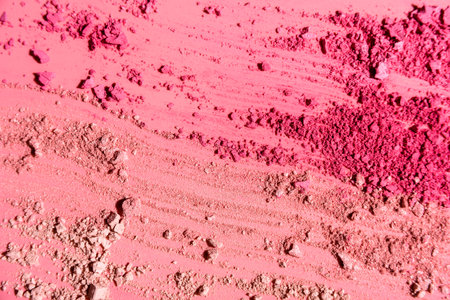 Abstract horizontal composition made from crushed face powder and blush on pink backgroundの写真素材
