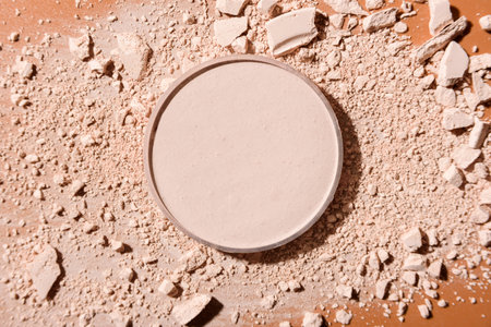 Cosmetic powder on brown background. Flat lay, top view.の写真素材