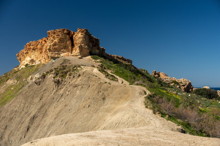 View to stone hill in Malta at coast, Gozoの写真素材