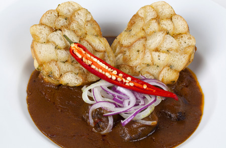 Excellent goulash with dumplings, hot peppers and onionsの写真素材