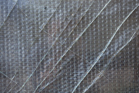 Old broken glass with cracksの写真素材