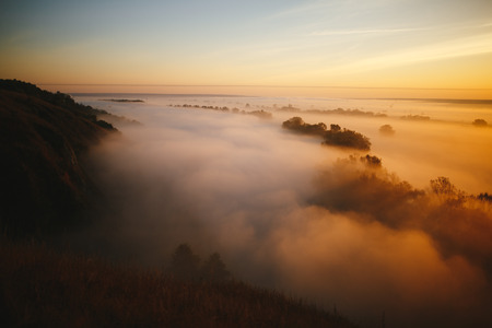 Misty sunrise on the river and on the forestの写真素材
