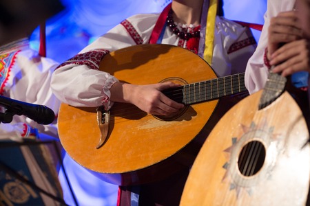 the guy plays an old stringed folk instrumentの写真素材