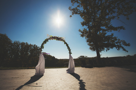 wedding arch decorated with flowers.の写真素材